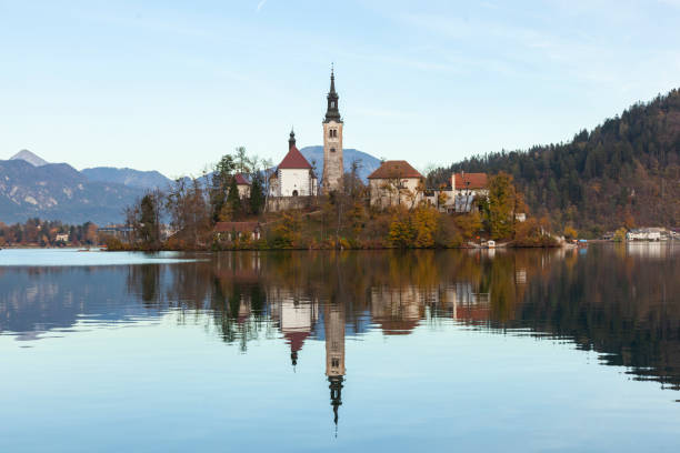 Autumn Reflections in the Lake Bled, Bled Slovenia Autumn Reflections in the Lake Bled, Bled Slovenia autumn field tree mountain stock pictures, royalty-free photos & images