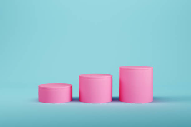 istock Pink cylindrical pedestal on light blue background for product display 1406228073