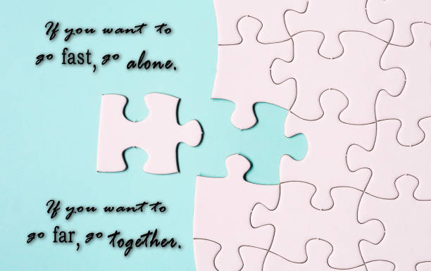 istock Motivational quote and white jigsaw puzzle with some missing pieces. 1406229171