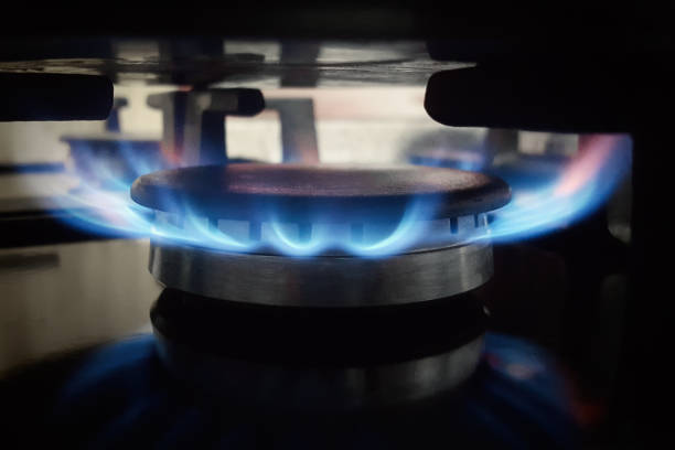 istock A lit gas burner burns with a blue flame on a kitchen stove 1406232010