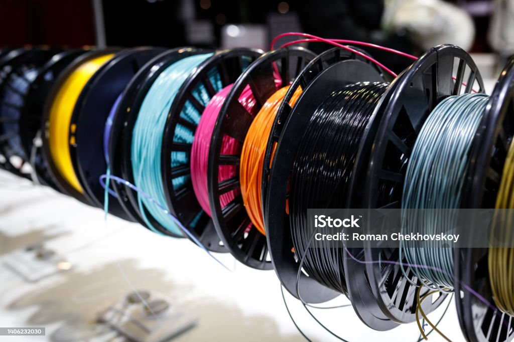 Lots of different coils with Colorful plastic PLA and ABS with filament for printing on a 3D pen Lots of different coils with Colorful plastic PLA and ABS with filament for printing on a 3D pen. Chinese People's Liberation Army Stock Photo