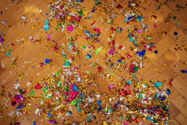 Confetti on the floor Wooden floor covered with confetti after party after party stock pictures, royalty-free photos & images