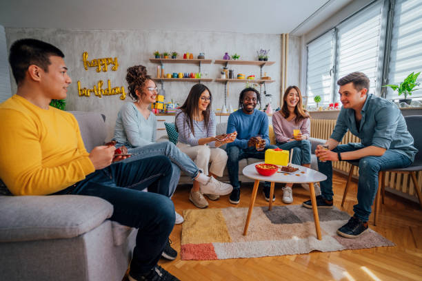 istock Multi-ethnic friends enjoying home birthday party 1406233047