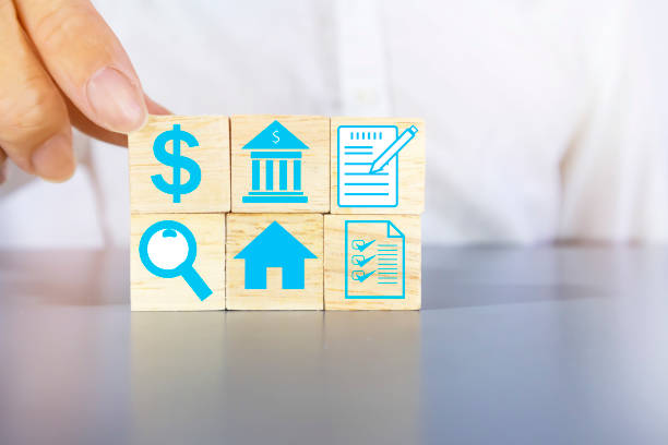 istock Finding a Home and Home Loan with Checking Various Management Documents,house business icon on wooden box light gray background 1406233263