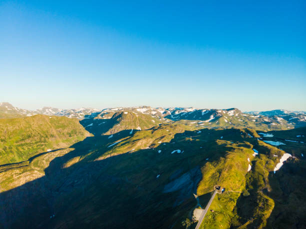 istock Road with tunnel in mountains Norway. Aerial view. 1406233634