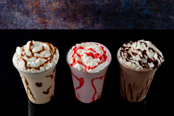 istock Milkshakes of different flavors on a dark background. 1406237247