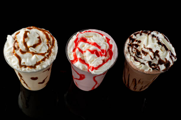 istock Milkshakes of different flavors on a dark background. 1406237260