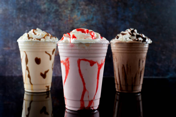 istock Milkshakes of different flavors on a dark background. 1406237376