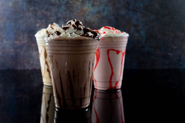 istock Milkshakes of different flavors on a dark background. 1406237379
