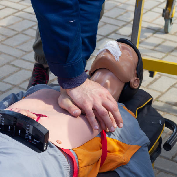 istock Resuscitation of a training plastic doll on a medical gurney, indirect heart massage tutorial 1406238373