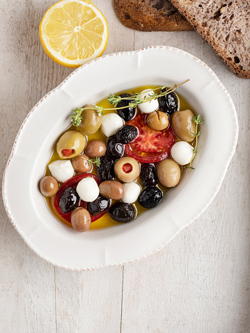 Antioxidant, Antipasto, Appetizer, Bowl, Olive, Mozarella Cheese, Food and drink, Tomato, Raw Olives, Oil, Breakfast, Bread, Thyme, Olives oil