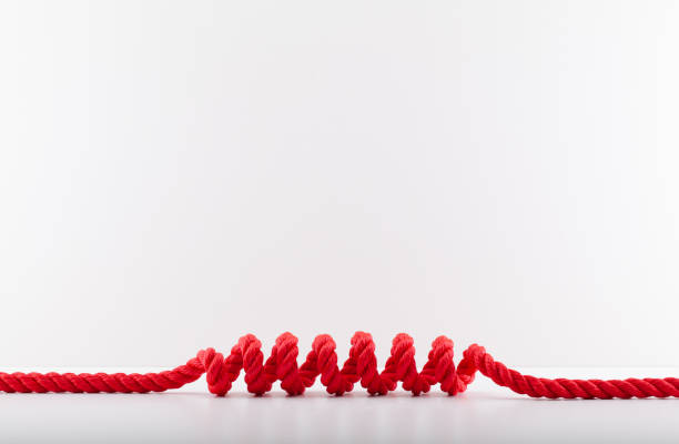 istock Red rope with a spiral Isolated on white background. 1406238605