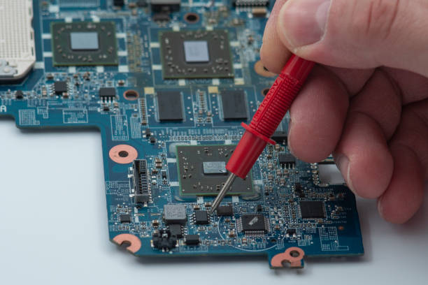 istock Fault search with measuring instrument on laptop motherboard 1406241499