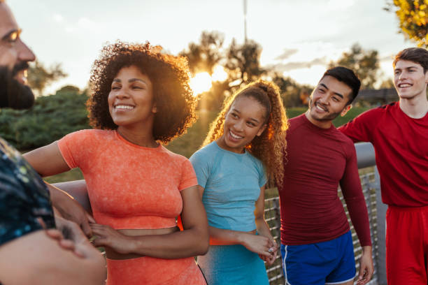 istock Group of athletic friends talking together 1406241601