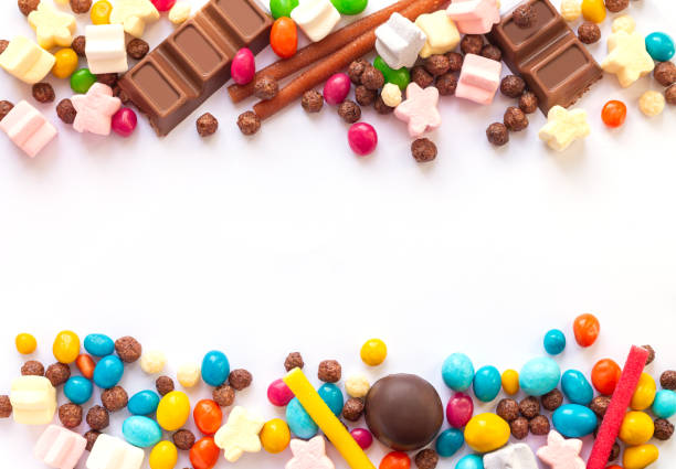 Mix of fruit candy and chocolate bonbon isolated on white background Colorful mixed fruit candy and chocolate bonbon isolated on white background. Top view candy jellybean variation color image stock pictures, royalty-free photos & images