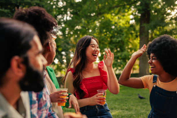 istock Friends in park laughing 1406242450