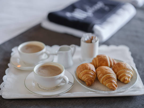 istock breakfast with coffee and croissant in hotel room 1406244454