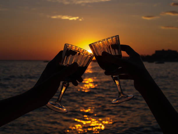 istock while a couple celebrates the sunset with wine 1406244496