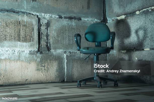 The Interrogation Chair An Old Chair In A Concrete Basement Stock Photo - Download Image Now