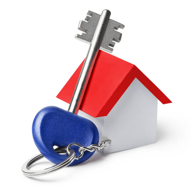 istock House key with house shaped keychain on white 1406244704