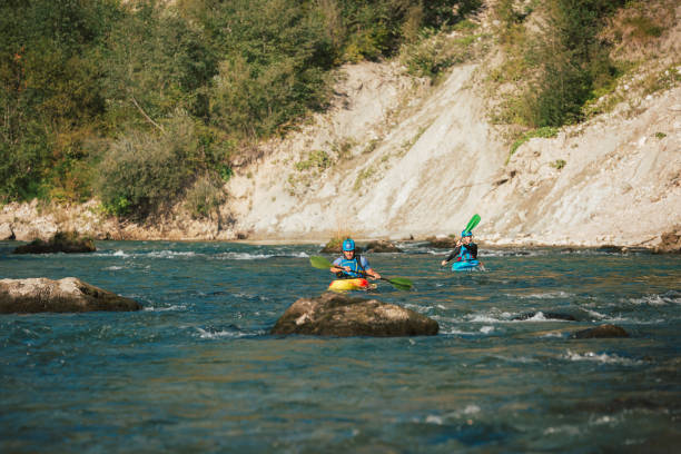 istock Whitewater kayaker paddling on river 1406244747