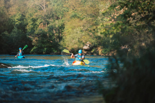 istock Whitewater kayaker paddling on river 1406244753