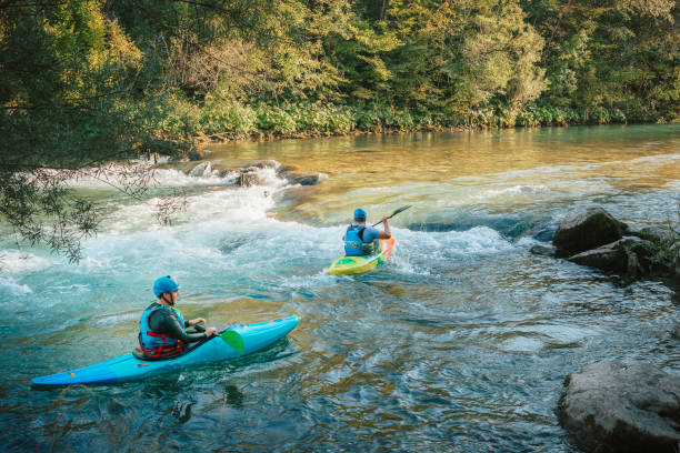 istock Whitewater kayaker paddling on river 1406244774