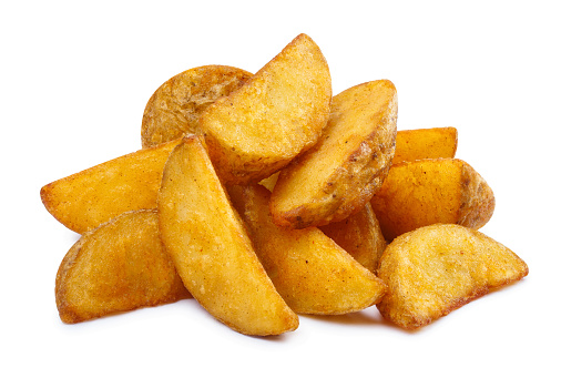 Delicious fried potato wedges, isolated on white background