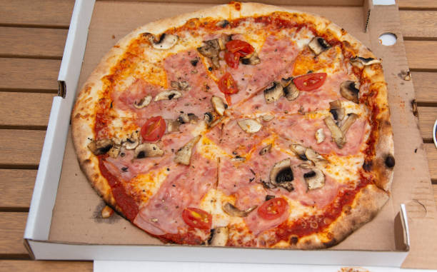 istock pizza with sausages, ham 1406246181