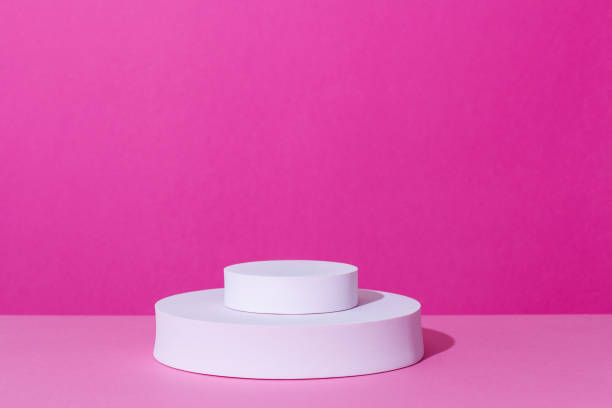 istock Empty podium or stand for product showcase on pink background 1406248128