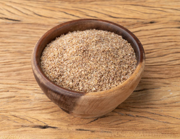 istock Ground whole wheat in a bowl over wooden table 1406248359
