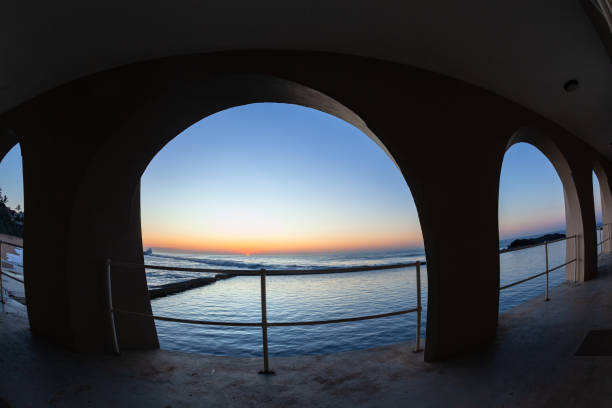 istock Beach Tidal Swimming Pool Arch Ocean Sunrise. 1406249270