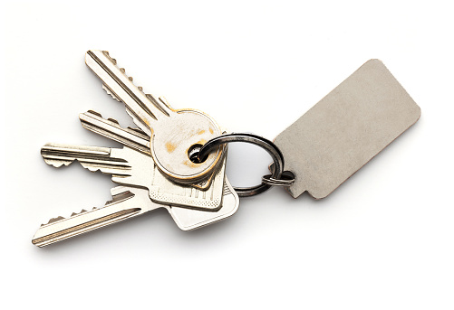 Two keys with keyring isolated on white background with copy space.
