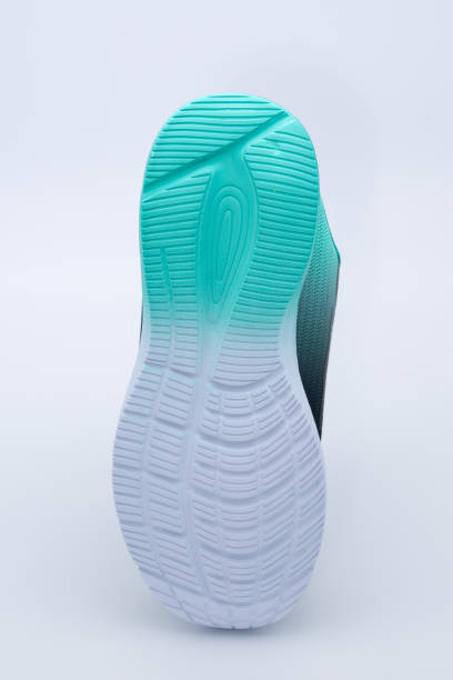 istock new green sport shoe on white background 1406252501
