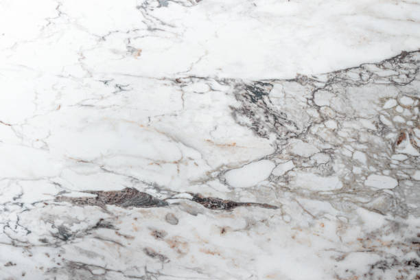 istock White marble stone texture top view. abstract pattern with grey and brown streaks for background or design art 1406252592