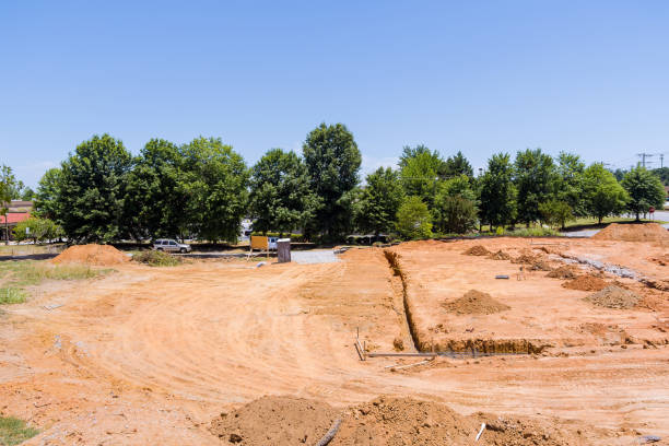 istock A view of a construction site with a trench being dug under a concrete foundation 1406255715