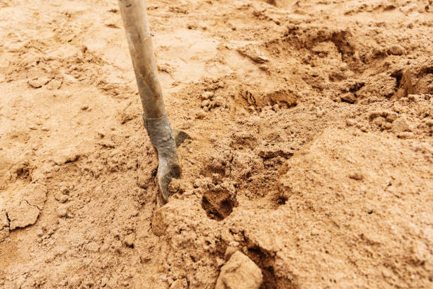 istock a pile of yellow river sand with a shovel on a construction site 1406256656