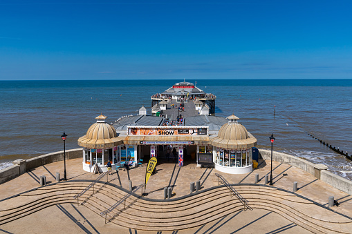 Early morning sunlight aerial view of famous Eastbourne pier Enghish Channel East Sussex England Europe