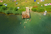 istock Aerial View of People Sunbathing and Swimming 1406258193
