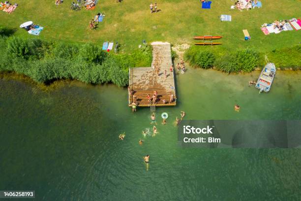 Aerial View Of People Sunbathing And Swimming Stock Photo - Download Image Now - Lake, Swimming, Germany