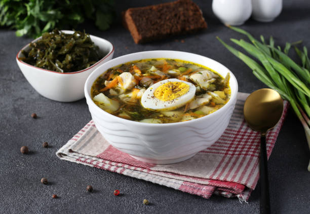 istock Kelp and chicken soup served with boiled egg in white bowl on dark gray background 1406259417