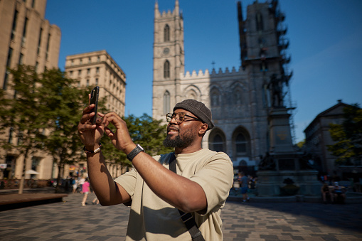 Young man visiting Notre Dame Church in Montreal