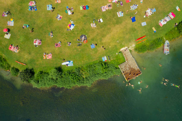 istock People Sunbathing and Swimming, Aerial View 1406261596