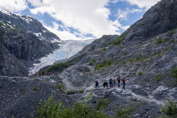 Seward, USA -  June 13, 2022. People hiking on Harding Icefield trail near Exit Glacier in Alaska. Exit Glacier is part of the Harding Icefield in Kenia Mountains in Alaska with easy access from land for people to explore.