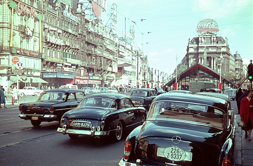 Brussels, Belgium, 1958. Street scene in Brussels in the year of the Universal Exhibition. Furthermore: vehicles, pedestrians, shops, advertising signs and buildings.