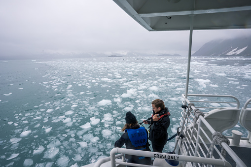 Seward, USA - June 13, 2022. Cruise ships take visitors from Port Seward to Kenai Fjords National Park, where ice is taken from the sea and displayed to travelers.