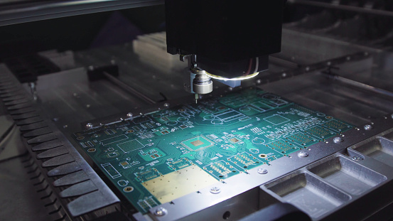 Printed circuit boards production factory. Technological process. Microchip production factory. Production of electric boards at factory.