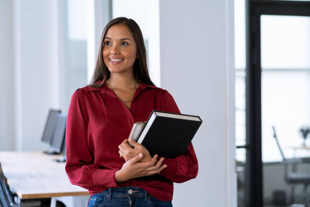 istock Young latin  woman working in the office looking away 1406276936