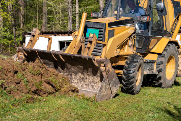 istock Excavator digs soil in village 1406277474