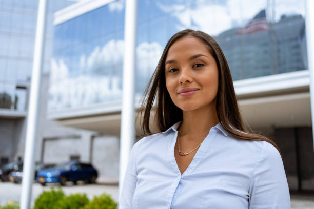 istock Confident young business woman outdoors looking at camera 1406277560